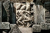 Prambanan - Candi Lara Jonggrang, miniature shrines surmounted by small fluted stupa with panels with musicians and dancers decorating the top of the balustrade 